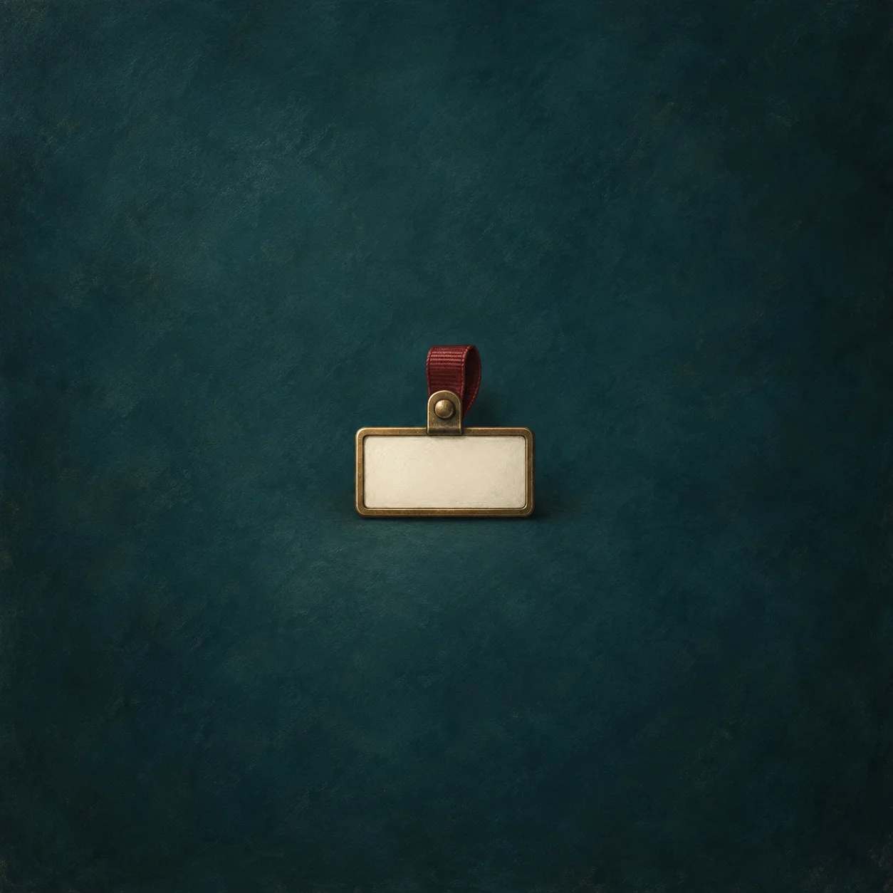 A blank ivory name badge in a brass holder hangs from a short burgundy ribbon against dark teal.