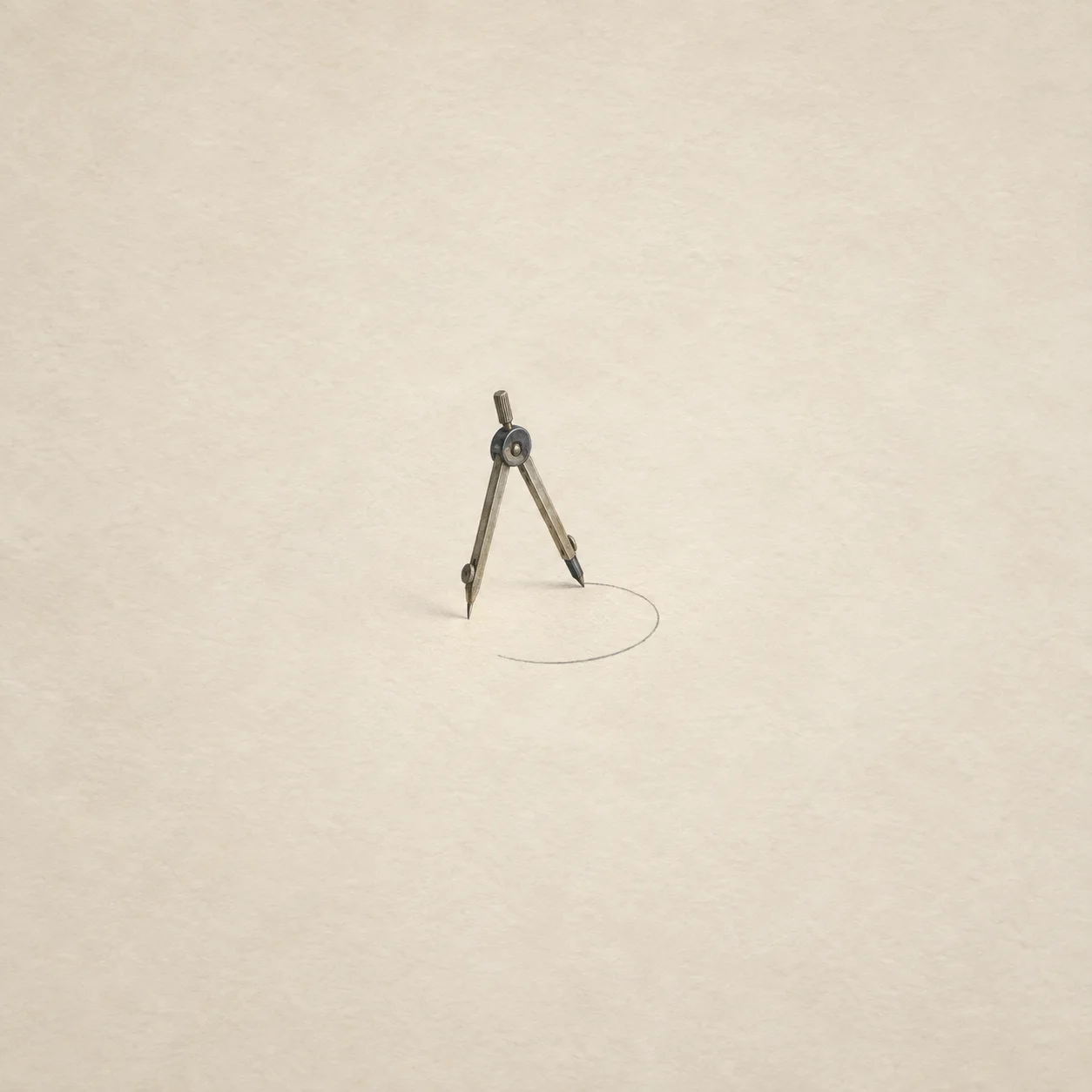A metal drafting compass stands over an unfinished circle on cream paper.