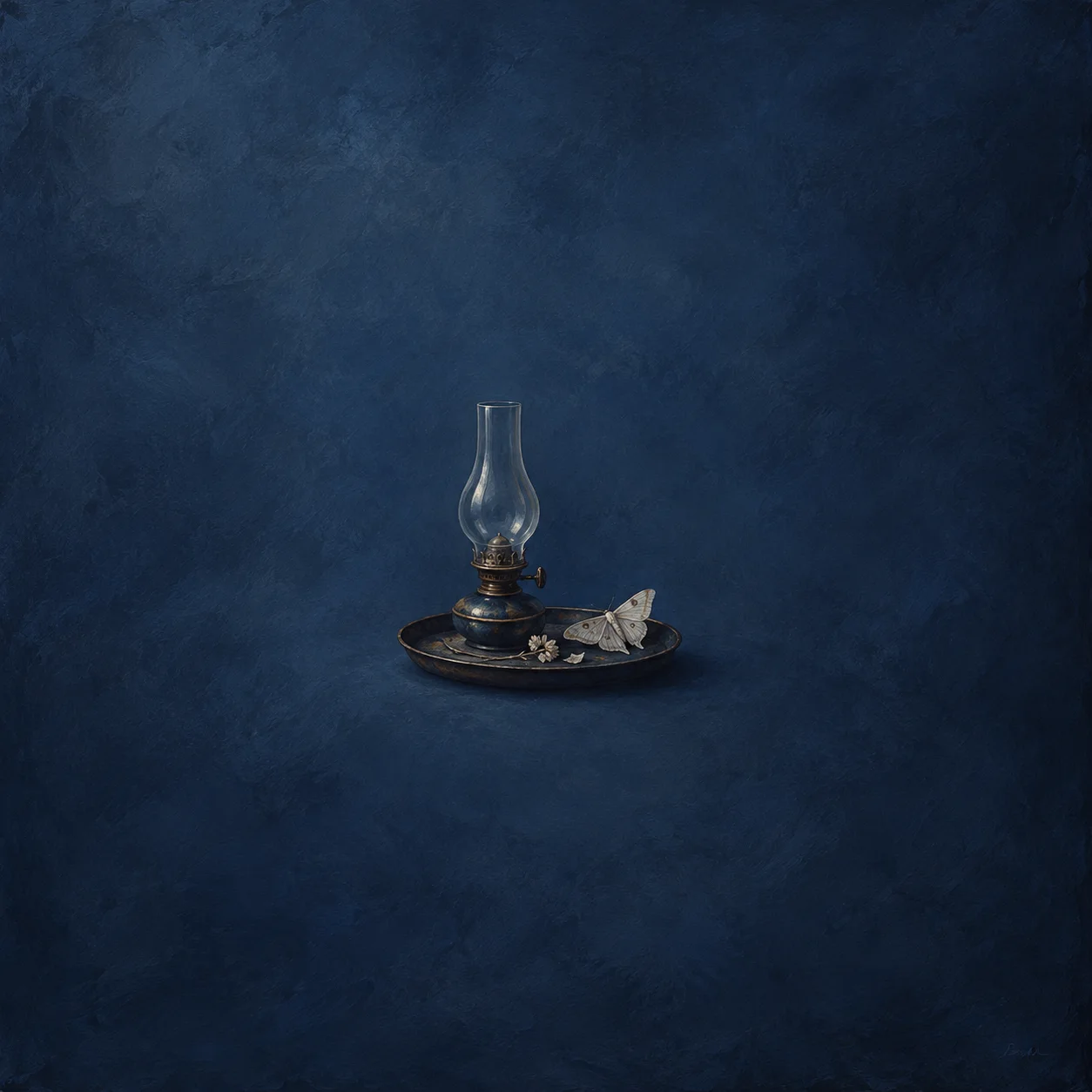 Unlit oil lamp on a low dark tray beside a pale moth and small pale blossoms
