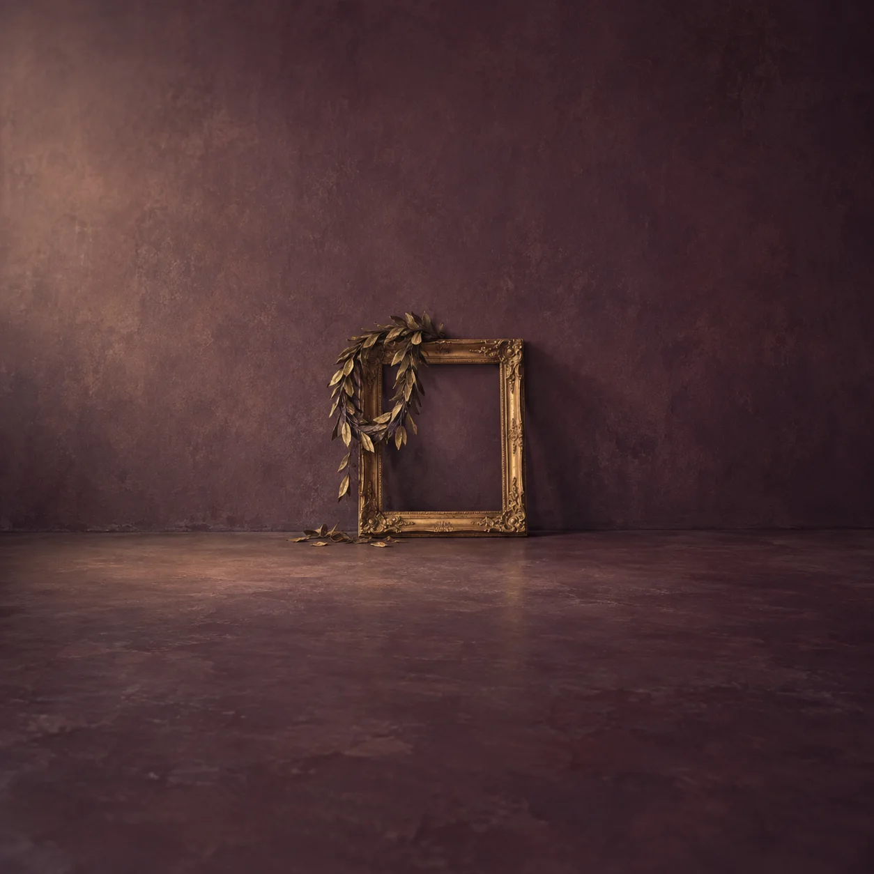 Painterly wilted laurel wreath draped over an empty gold picture frame against plum.