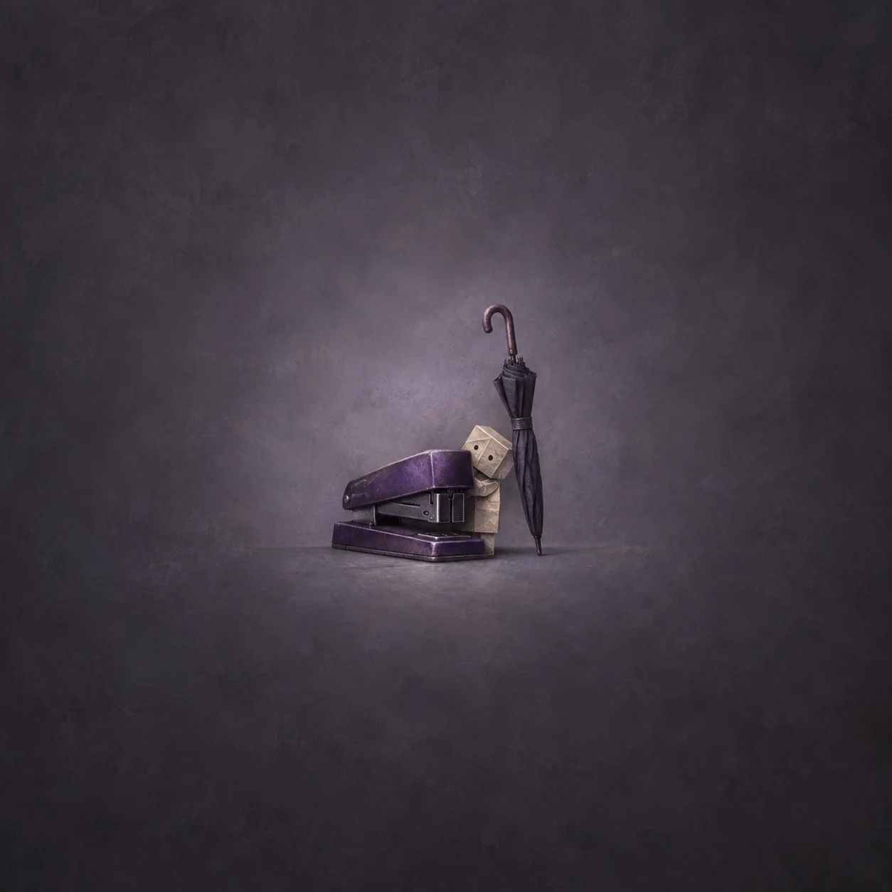A small paper figure peers from behind a purple stapler beside a tall closed umbrella.