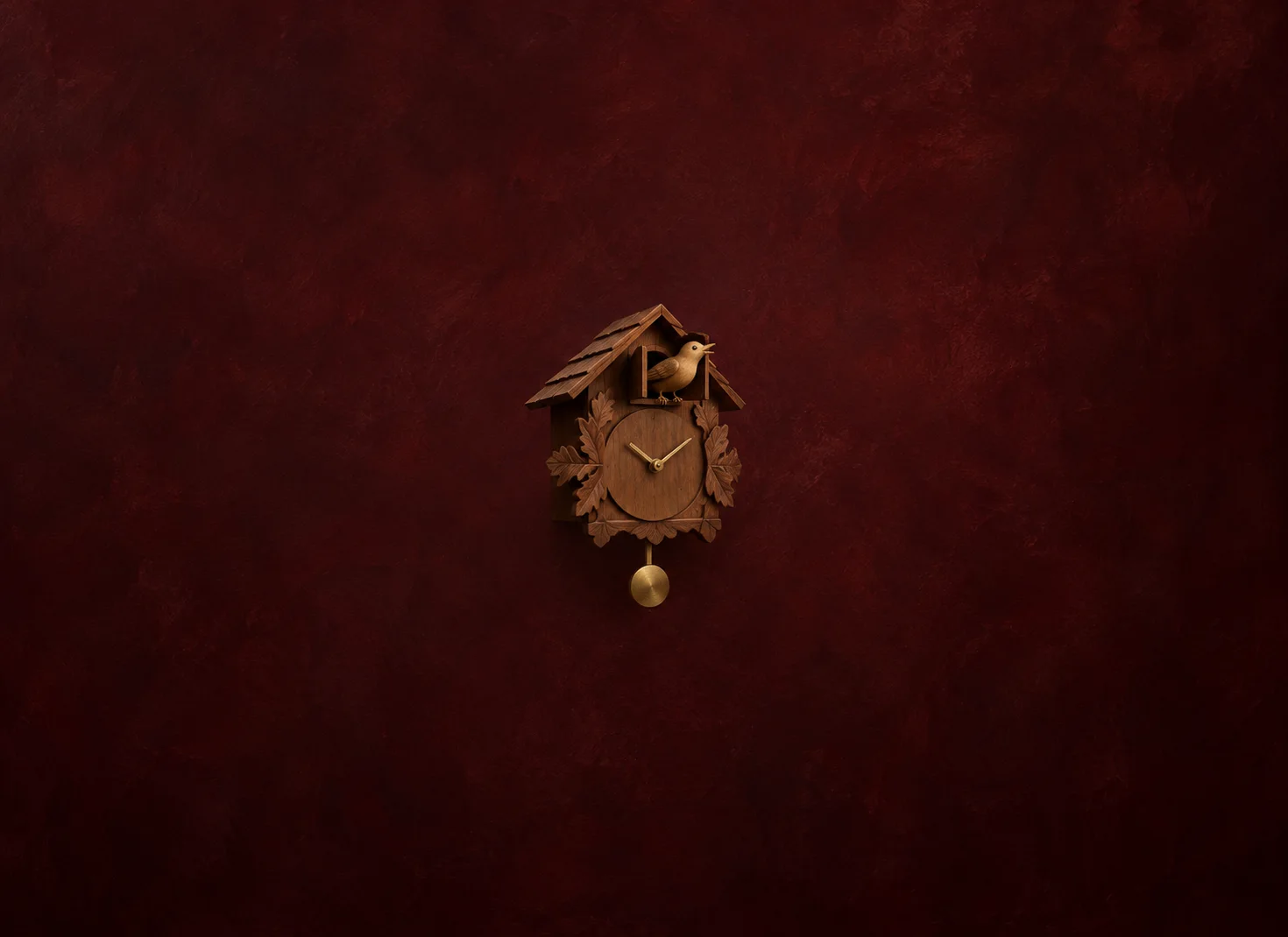 A small carved wooden cuckoo clock with a bird emerging from its door and a brass pendulum against dark red.