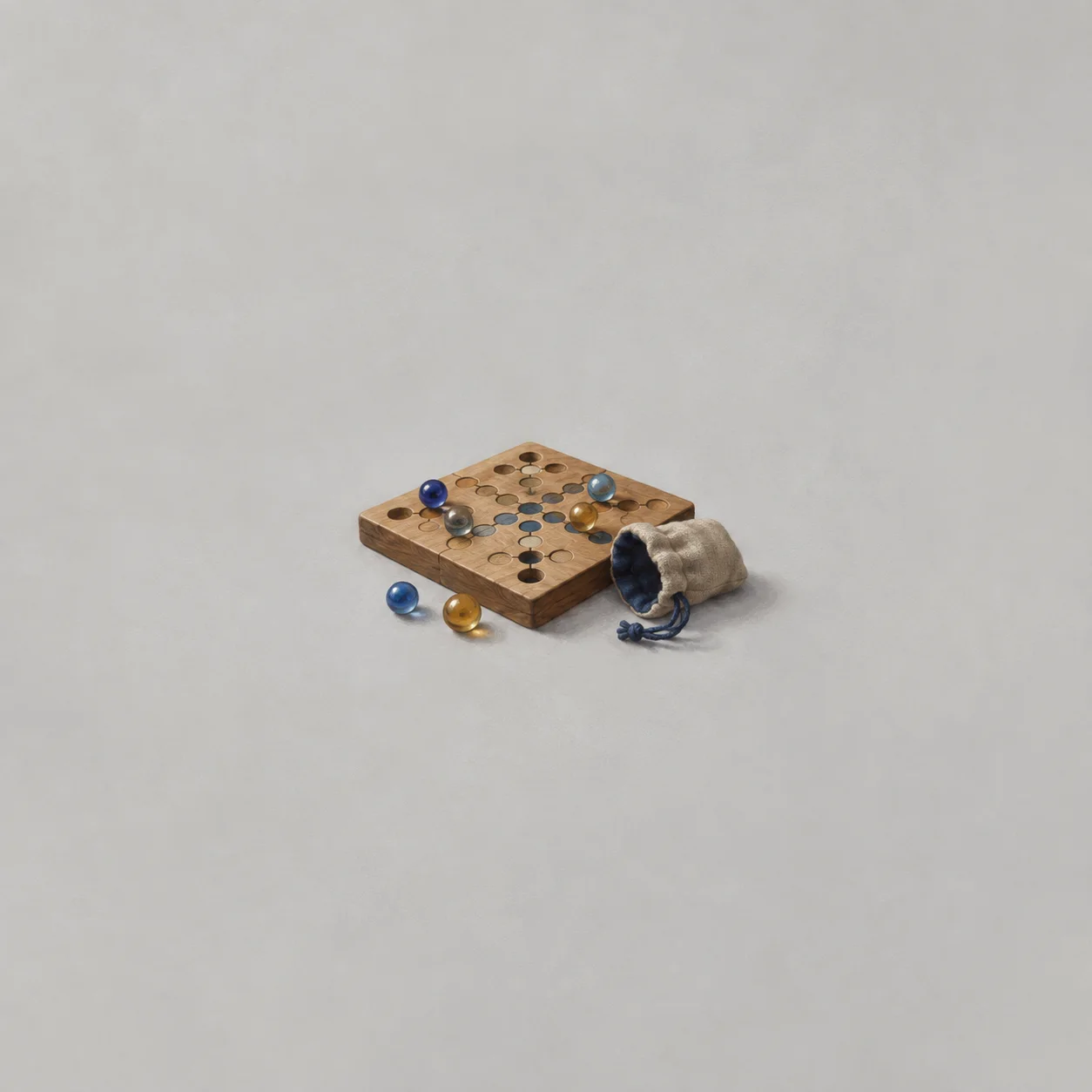 Glass marbles and a small cloth pouch on a small wooden game board, in ochre and cobalt tones.