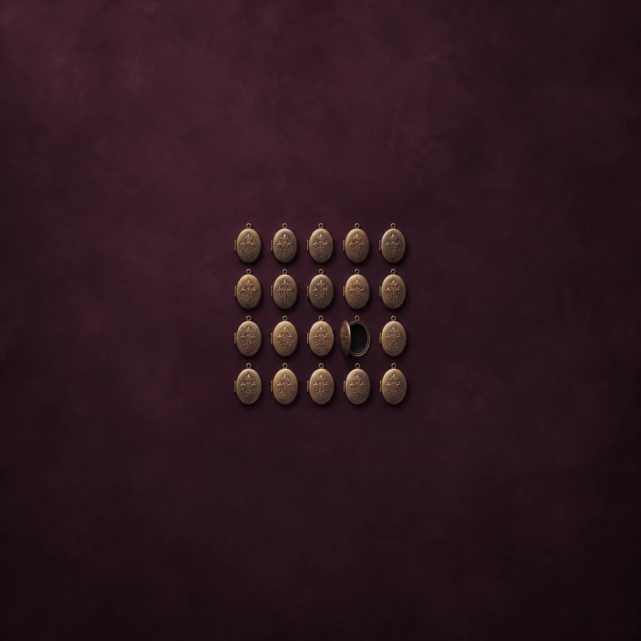 Small oval metal lockets form a grid against a plum background, with one open locket showing a dark interior.