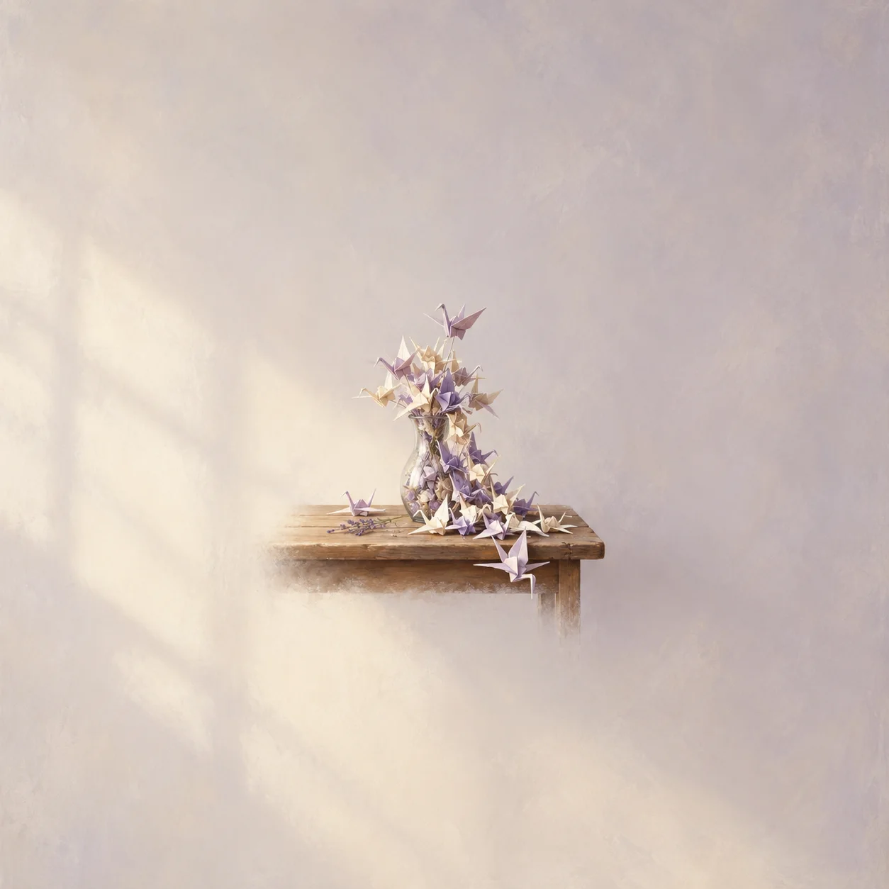 Folded paper cranes gather around a narrow glass vase and scatter across a small wooden shelf in soft light.