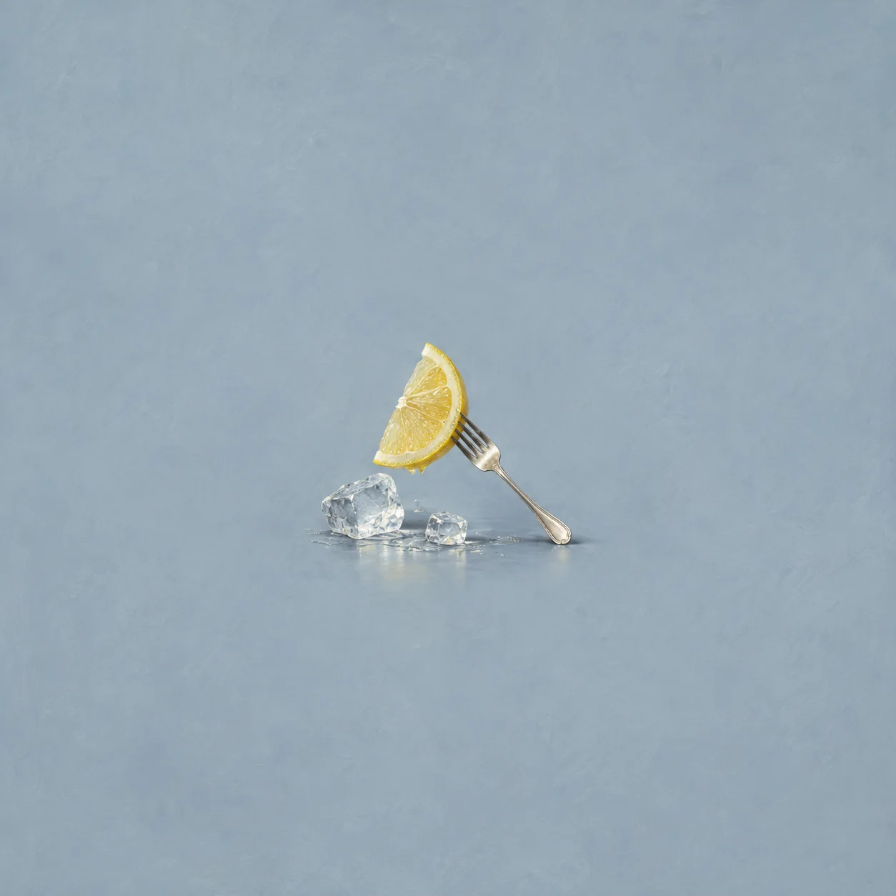 A lemon wedge rests on a silver fork beside chunks of cracked ice against a pale-blue background.