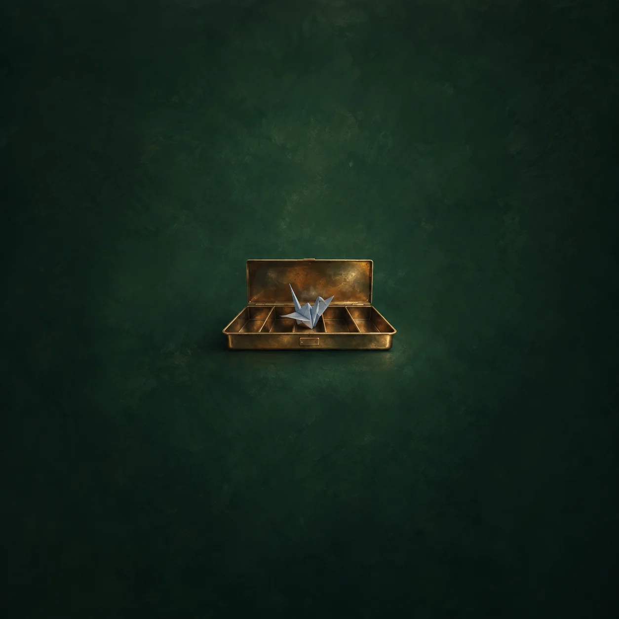 A folded blue paper crane resting in an open brass cash tray against a deep green background.