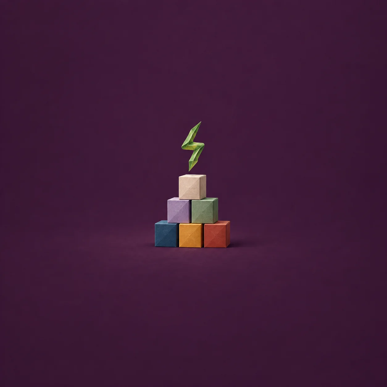 Six coloured cubes form a pyramid beneath a floating green zigzag ribbon against dark purple.