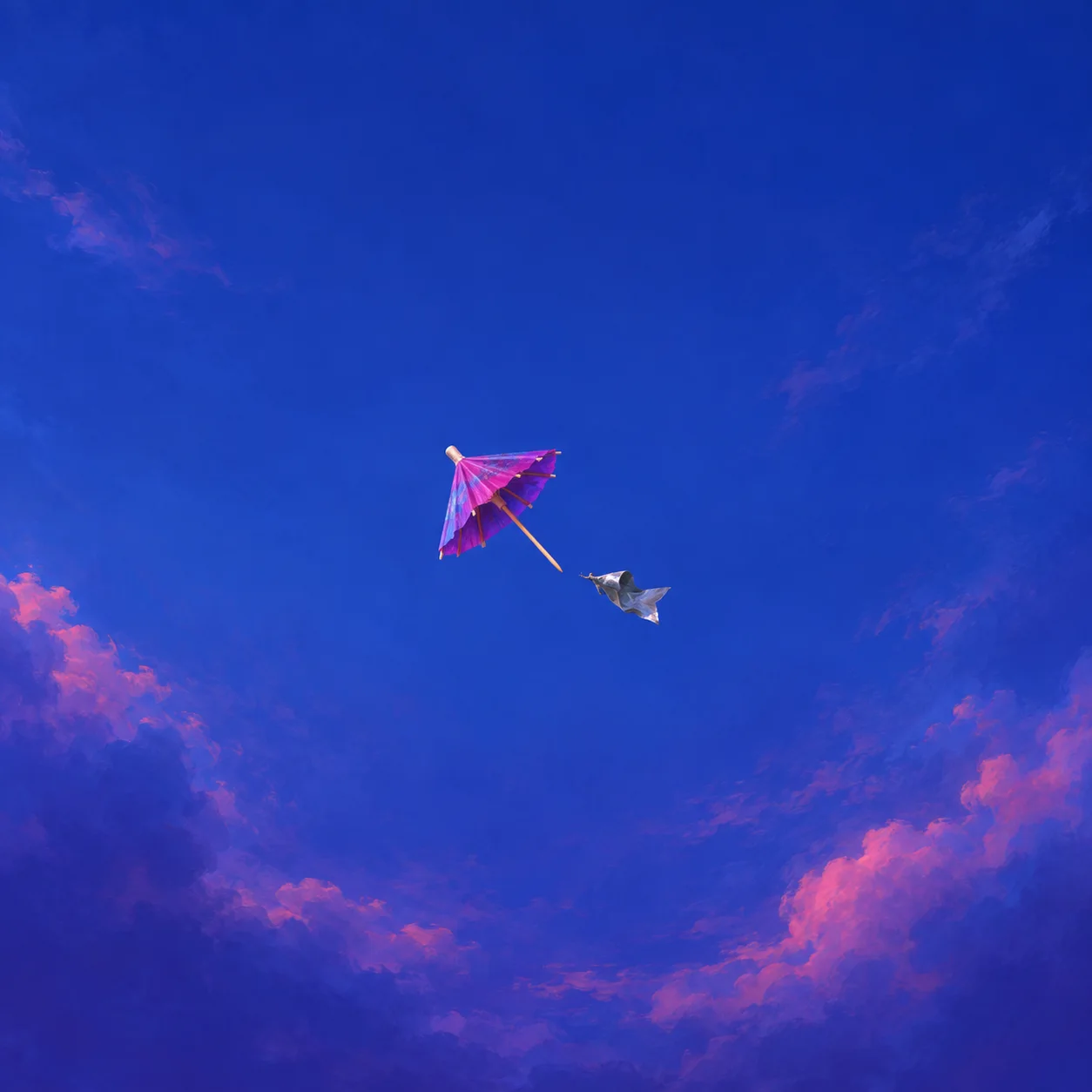 A pink paper umbrella with a scrap of silver fabric trailing behind against a deep blue sky with pink clouds.