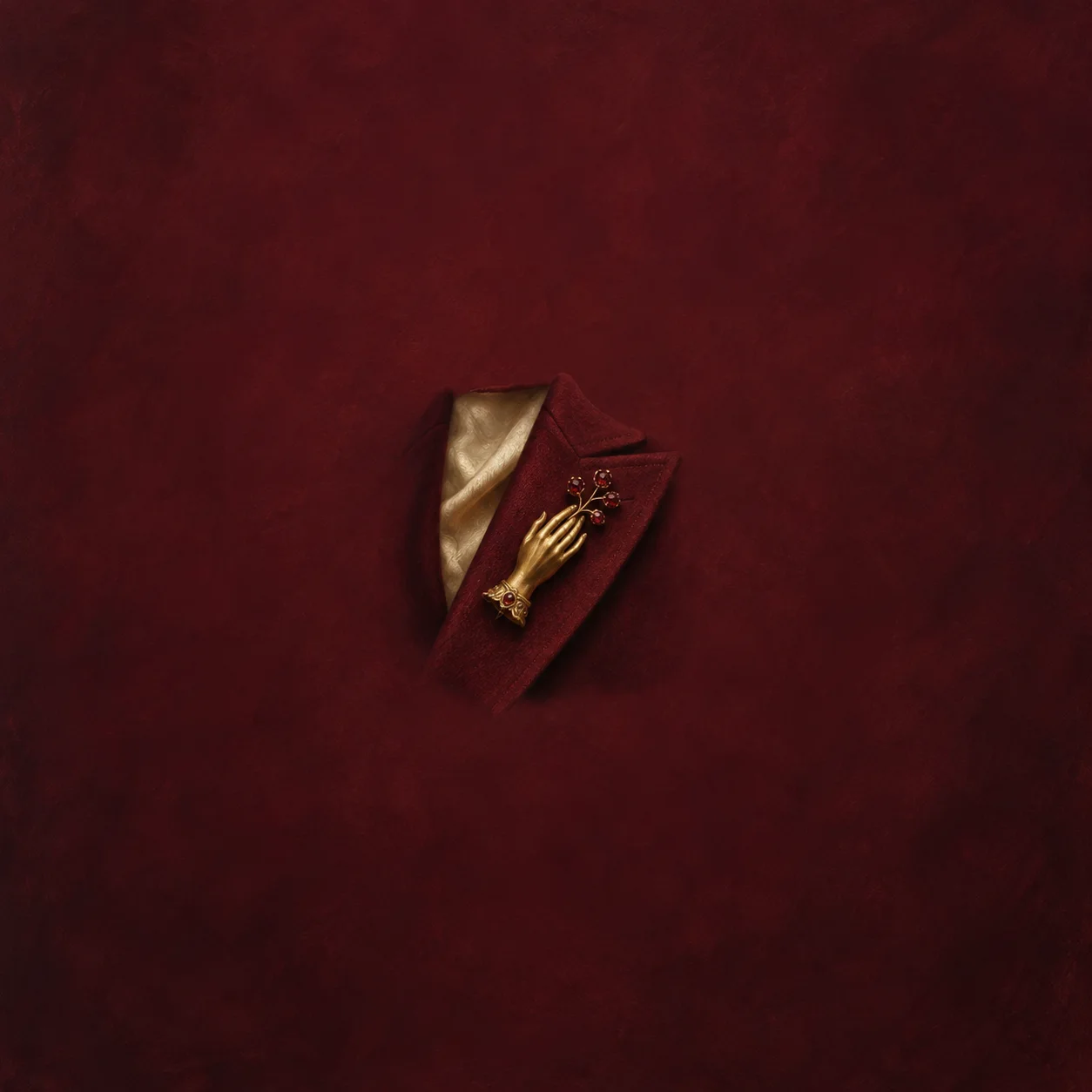 Tailored burgundy lapel with a gold hand-shaped brooch and small red stones