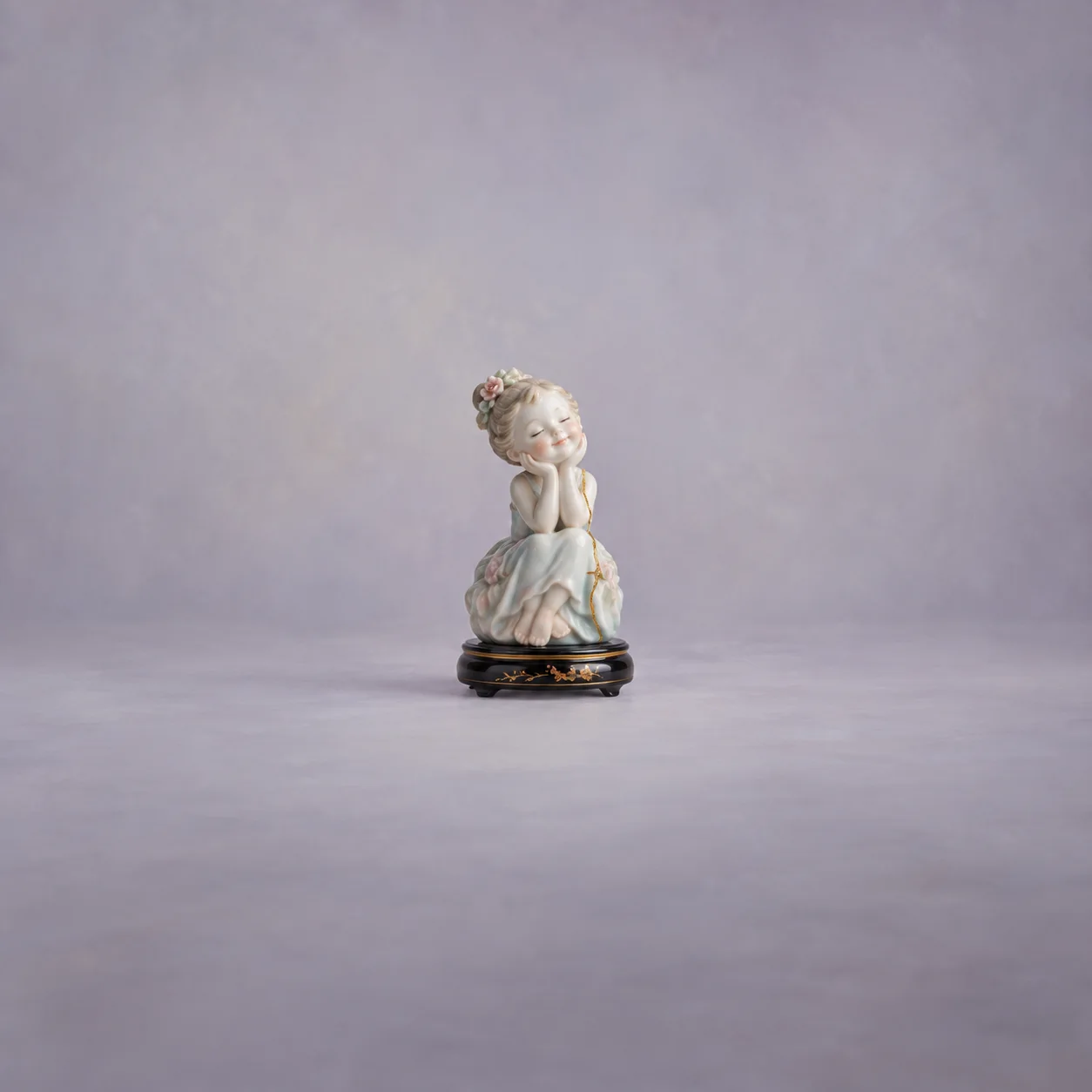 A smiling pastel porcelain figurine rests on a dark pedestal with gold detailing against lilac.