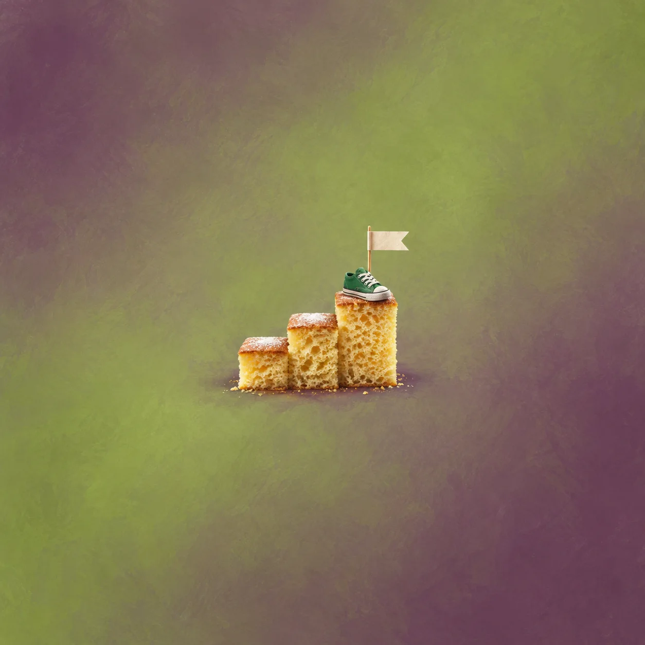 Three sponge-cake steps lead up to a tiny green trainer and a blank paper flag.