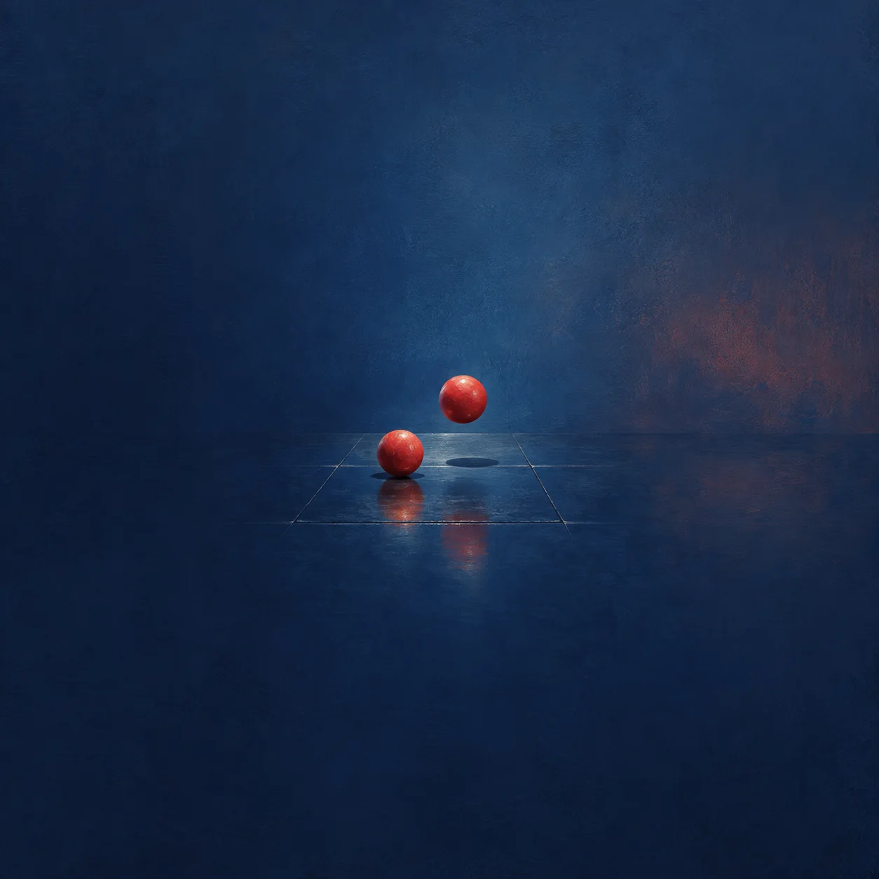Two red balls sit at different heights above glossy dark-blue floor tiles, with reflections below.