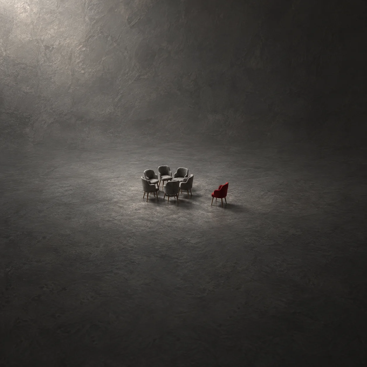 One small red chair set apart from a cluster of grey chairs on a dark floor.