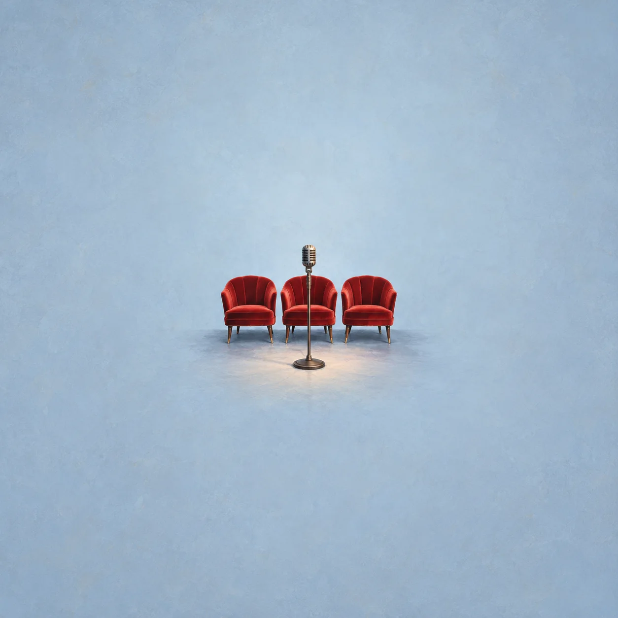 A vintage microphone on a stand in front of three empty red chairs against a powder-blue background.