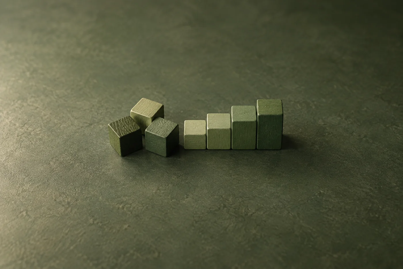 Loose green wooden blocks lead into a neat ascending row.