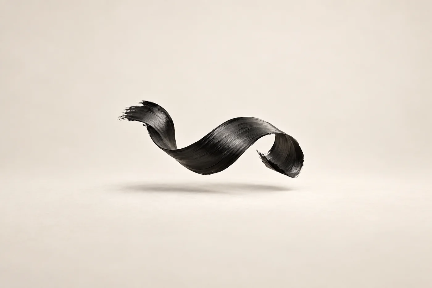 A broad black ribbon with brush-like edges floats in a fluid curve over ivory.